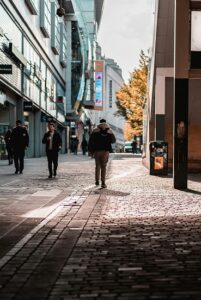 a group of people walking down a street